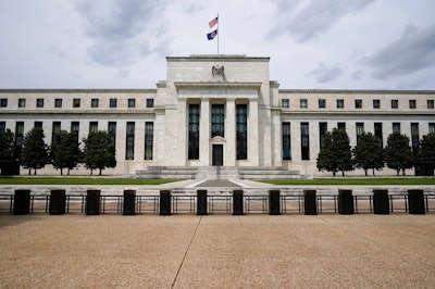 In this May 4, 2021, file photo is the Federal Reserve in Washington. The Federal Reserve's latest nationwide business survey found that the economy strengthened further in late May and early June, despite supply-chain bottlenecks that led to price hikes. The Fed said Wednesday, July 14, 2021 that seven of its 12 regional bank districts reported strong price increases, with the other five reporting moderate gains in prices.