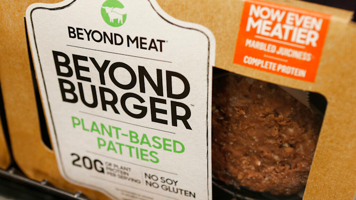 In this June 27, 2019 photo, a meatless burger patty called Beyond Burger made by Beyond Meat is displayed at a grocery store in Richmond, Va.