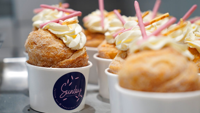 Strawberry Pocky Cruffins are displayed on a tray at the Sunday Bakeshop in Oakland, Calif., Thursday, Aug. 19, 2021. From ube cakes to mochi muffins, bakeries that sweetly encapsulate what it is to grow up Asian and American have been popping up more in recent years. Their confections are a delectable vehicle for young and intrepid Asian Americans to celebrate their dual identity.