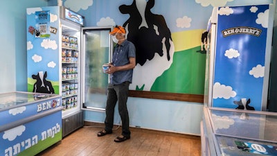 In this July 20 photo, an Israeli shops at the Ben & Jerry's ice-cream factory in the Be'er Tuvia Industrial area, southern Israel.