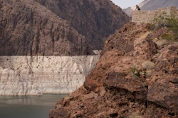 A person looks out over Lake Mead near Hoover Dam at the Lake Mead National Recreation Area in Arizona, Aug. 13, 2021.