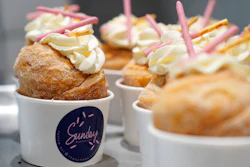 Strawberry Pocky Cruffins are displayed on a tray at the Sunday Bakeshop in Oakland, Calif., Thursday, Aug. 19, 2021. From ube cakes to mochi muffins, bakeries that sweetly encapsulate what it is to grow up Asian and American have been popping up more in recent years. Their confections are a delectable vehicle for young and intrepid Asian Americans to celebrate their dual identity.