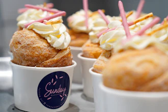 Strawberry Pocky Cruffins are displayed on a tray at the Sunday Bakeshop in Oakland, Calif., Thursday, Aug. 19, 2021. From ube cakes to mochi muffins, bakeries that sweetly encapsulate what it is to grow up Asian and American have been popping up more in recent years. Their confections are a delectable vehicle for young and intrepid Asian Americans to celebrate their dual identity.