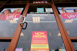A Now Hiring sign at a business in Richmond, Va., Wednesday, June 2, 2021. U.S. employers posted a record 10.1 million job openings in June, another sign that the job market and economy are bouncing back briskly from last year’s coronavirus shutdowns. The Labor Department reported Monday, Aug. 9, 2021 that job openings rose from 9.5 million in May.
