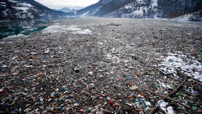 Plastic bottles and other garbage floats in the Potpecko lake near Priboj, Serbia, Jan. 22, 2021.