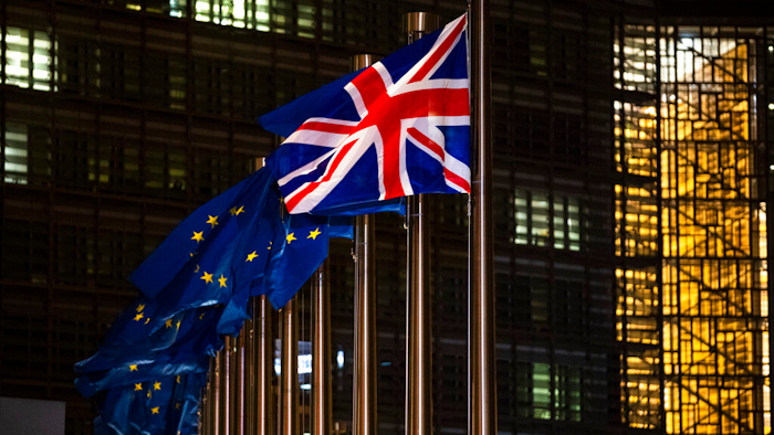 In this Dec. 9, 2020 file photo, the Union Flag and European Union flags flap in the wind prior a meeting between European Commission President Ursula von der Leyen and British Prime Minister Boris Johnson at EU headquarters in Brussels.
