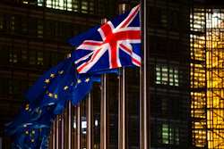 In this Dec. 9, 2020 file photo, the Union Flag and European Union flags flap in the wind prior a meeting between European Commission President Ursula von der Leyen and British Prime Minister Boris Johnson at EU headquarters in Brussels.