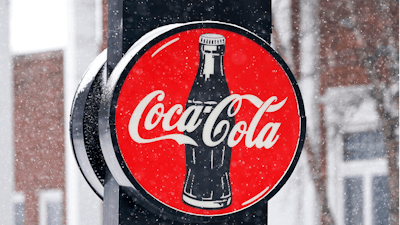 A Coca-Cola sign hangs outside a Coca-Cola distributo on Feb. 9, 2021 in Bedford, Ohio.