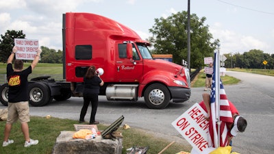 Bettye Jo Boone, a 30 year employee of Heaven Hill, pickets in front of Heaven Hill Distillery in Bardstown, Ky., Monday, Sept. 13, 2021. Declaring an impasse in contract talks with striking union workers, global spirits producer Heaven Hill said Monday, Oct. 18 it will start hiring permanent replacement workers for bottling and warehouse operations in Kentucky.