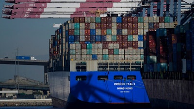 A Cosco container ship is docked at the Port of Long Beach in Long Beach, CA on Oct. 1, 2021.