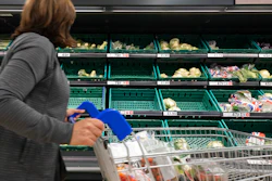 A view of empty shelves at a Tesco supermarket in Manchester, England on Sept 12, 2021.