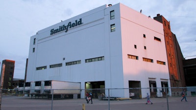 Employees of two departments at the Smithfield pork processing plant in Sioux Falls, S.D. report to work on May 4, 2020 as the plant moved to reopen after a coronavirus outbreak infected workers.