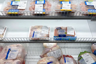 A near empty case of different chicken cuts is displayed at a Publix Supermarket on Oct. 20, 2021 in Miami.