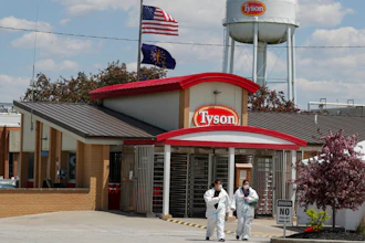 In this May 7, 2020 photo, workers leave the Tyson Foods pork processing plant in Logansport, Ind.