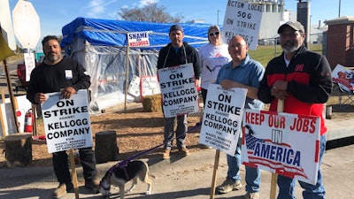 Striking Kellogg's workers Michael Rodarte, Sue Griffin, Michael Elliott, Eric Bates and Mark Gonzalez stand outside the Omaha, NE cereal plant on Dec. 2, 2021.