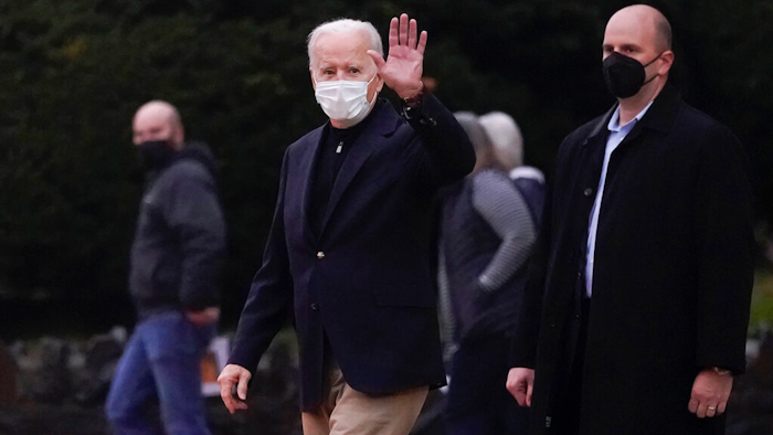 President Joe Biden waves as he leaves St. Ann Roman Catholic Church after attending Mass in Wilmington, DE on Jan. 1, 2022.
