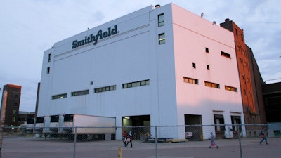 Employees of two departments at the Smithfield pork processing plant in Sioux Falls, S.D. report to work on May 4, 2020 as the plant moved to reopen after a coronavirus outbreak infected workers.