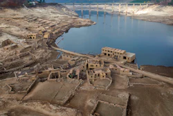 Parts of the old village of Aceredo, submerged three decades ago when a hydropower dam flooded the valley, are photographed emerged due to drought at the Lindoso reservoir, in northwestern Spain on Feb. 12, 2022.