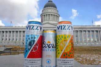 A can of Coors Seltzer Mango, center, is shown with Vizzy Blueberry Pomegranate, left, and Vizzy Pineapple Mango, in front of the Utah State Capitol on Feb. 17, 2022, in Salt Lake City.