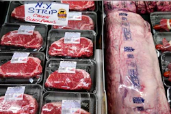 In this Tuesday, June 15, 2021 file photograph, beef is displayed in the meat department at Lambert's Rainbow Market, in Westwood, Mass. Wholesale inflation in the United States surged again last month, rising 9.7% from a year earlier in a sign that price pressures remain high at all levels of the economy. The Labor Department said Tuesday, Feb. 15, 2022, that its producer price index — which measures inflation before it reaches consumers — jumped 1% from December.