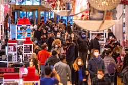 People shop in Macy's on Nov. 26, 2021, in New York. Americans picked up the spending pace in January as the threat of omicron faded and there was some easing of supply shortages. Retail sales rose a seasonally adjusted 3.8% Jan. 2022, compared to the prior month when the number dropped a revised 2.5%.