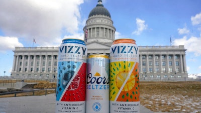 A can of Coors Seltzer Mango, center, is shown with Vizzy Blueberry Pomegranate, left, and Vizzy Pineapple Mango, in front of the Utah State Capitol on Feb. 17, 2022, in Salt Lake City.