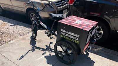 A delivery bicycle is parked in front of Gorillas mini-warehouse, Williamsburg, Brooklyn, New York, April 12, 2022.