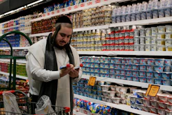 Moshe Werzberger shops for Passover food and other groceries at a kosher supermarket, Williamsburg, Brooklyn, New York, April 19, 2022.