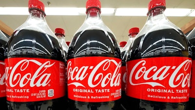 Bottles of Coca-Cola on display at a grocery store in Uniontown, Pa., April 24, 2022.