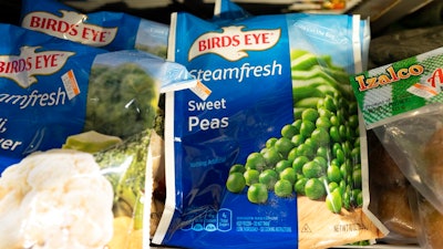 A bag of Birds Eye sweet peas is displayed Thursday, March 25, 2021, in a New York supermarket. Inflation is pressuring ConAgra Brands' performance and the food company is lowering its fiscal full-year adjusted earnings outlook as it contends with higher-than-anticipated cost pressures. ConAgra, whose brands include Birds Eye, Slim Jim and Reddi-wip, also said Thursday, April 7, 2022, that it will need to make additional price increases to deal with the current environment.