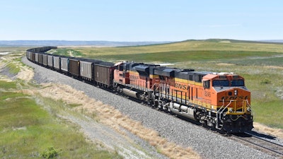 A BNSF railroad train hauling carloads of coal from the Powder River Basin of Montana and Wyoming is seen east of Hardin, Mont., on July 15, 2020. The major freight railroads are hiring aggressively and asking customers to cut the number of carloads they are shipping to reduce congestion along the rail network in response to concerns from agricultural and ethanol groups that prompted regulators to schedule a hearing on the problems.