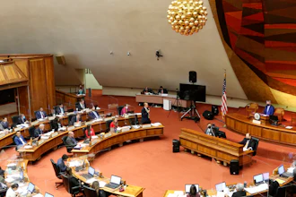Members of the Hawaii House of Representatives discuss legislation at the State Capitol in Honolulu, May 3, 2022.