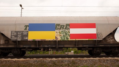 Ukrainian and Austrian flags painted on a freight train with fodder maize arriving from the Ukraine, Vienna, May 6, 2022.