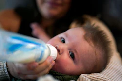 Ashley Maddox feeds her 5-month-old son, Cole, with formula she bought through a Facebook group of mothers in need Thursday, May 12, 2022, in Imperial Beach, Calif. 'I connected with a gal in my group and she had seven cans of the formula I need that were just sitting in her house that her baby didn't need anymore,' she said. 'So I drove out, it was about a 20-minute drive and picked it up and paid her. It was a miracle.'
