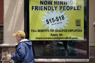 Starting wages advertised in the window of a Taco Bell in Sacramento, Calif., May 9, 2022.