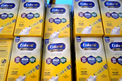 Infant formula is stacked on a table during a baby formula drive, Houston, May 14, 2022.