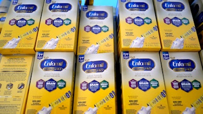 Infant formula is stacked on a table during a baby formula drive, Houston, May 14, 2022.