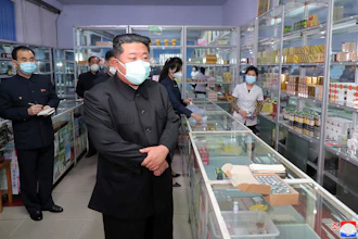 In this photo provided by the North Korean government, North Korean leader Kim Jong Un visits a pharmacy in Pyongyang, May 15, 2022.