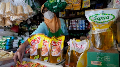 Packs of palm cooking oil displayed at a market in Jakarta, April 17, 2022.