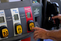 A customer pumps gas at an Exxon gas station, May 10, 2022, Miami.