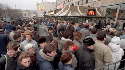 Hundreds of Muscovites line up outside the first McDonald's restaurant in the Soviet Union on its opening day, in Moscow, Jan. 31, 1990.