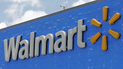 A Walmart sign displayed on the facade of a store in Hialeah Gardens, Fla., on June 1, 2017. Walmart is adding four new fulfillment centers to its existing capacity, a move that will bring more than 4,000 jobs and make next- or two-day shipping available to more Americans.