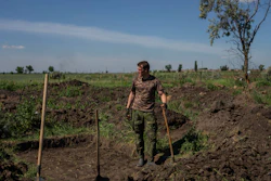 A Ukrainian serviceman digs trenches near the frontline in Donetsk region, June 8, 2022.