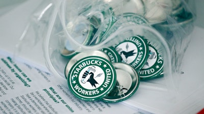 Starbucks union pins on display in Buffalo, N.Y., Dec. 9, 2021.