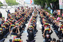Members of Cargo Truckers Solidarity of the Korean Confederation of Trade Unions shout slogans during a rally in Gwangju, South Korea, June 10, 2022.