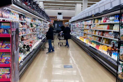Customers shop at a grocery store in Mount Prospect, Ill., April 1, 2022.