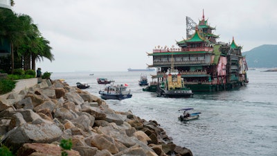 The Jumbo Floating Restaurant is towed away in Hong Kong, June 14, 2022.