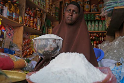 A shopkeeper sells wheat flour in the Hamar-Weyne market in Mogadishu, Somalia, May 26, 2022.