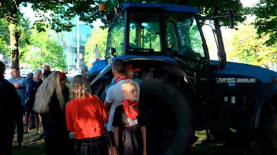 A small group of people gather ahead of a major protest by farmers, The Hague, Netherlands, June 22, 2022.