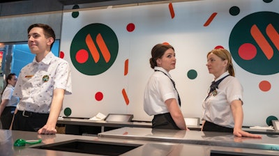 Staff members wait for visitors at a newly opened fast food restaurant in a former McDonald's outlet, Moscow, June 12, 2022.